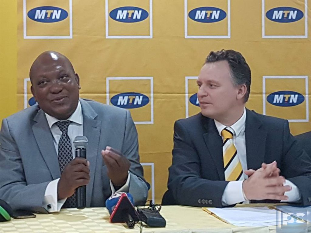 MTN Uganda CEO, Wim Vanehellepute (Right) looks at the Chairperson MTN Foundation Mr. George William Egadu during the press conference that was held on Monday March 6th at MTN Towers in Kampala.