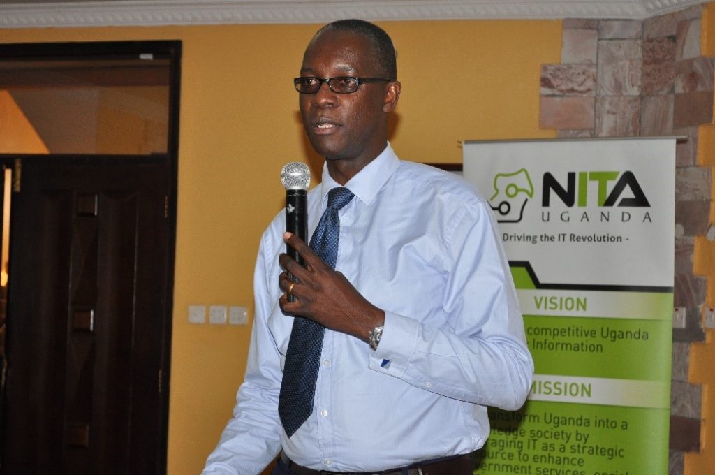 Wilbrod Humphreys Owor, Executive Director, Uganda Banker’s Association, gives remarks during the meeting with NITA-U.