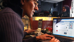 A cybercafe customer in Cairo, Egypt, looks at Facebook on Thursday, before widespread service outages.