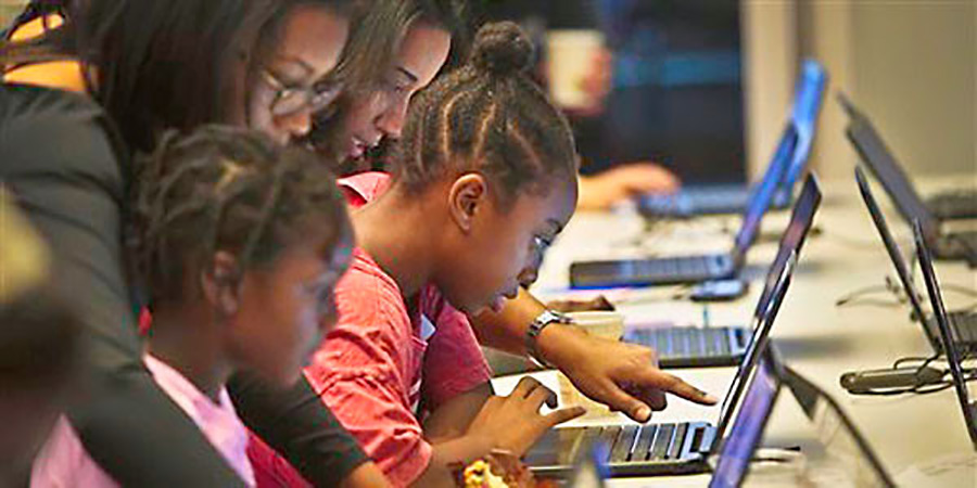 Photo of Is it necessary to teach poor kids to code?