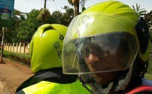 A passenger takes a photo of himself on a taxifyboda. (Photo Credit: Twitter - @rideshareuganda)