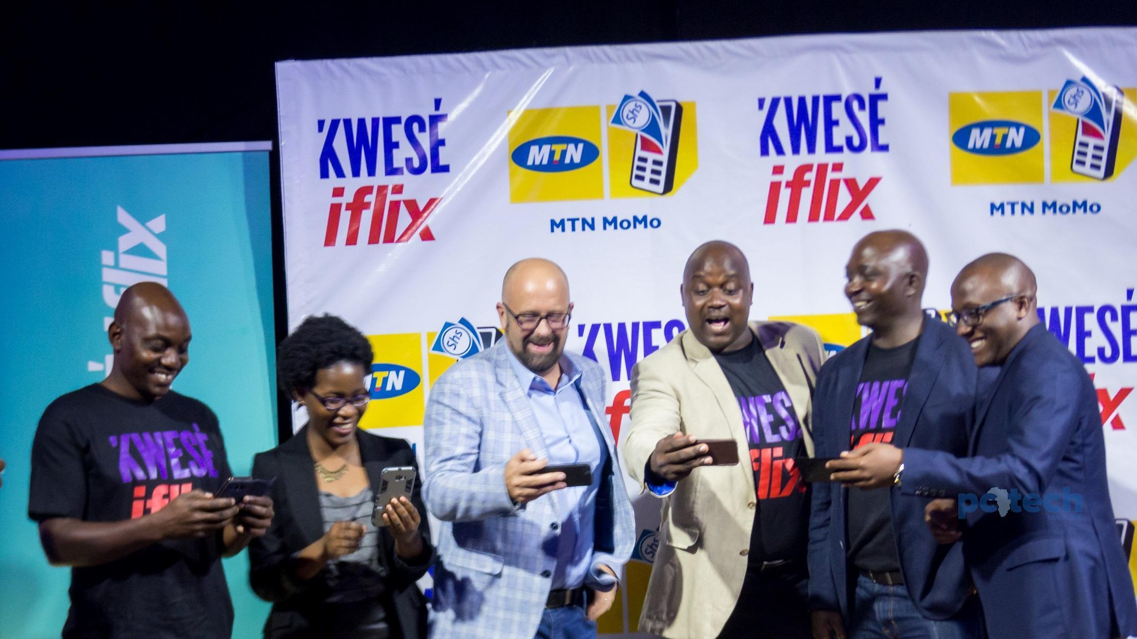 Susan Kayemba, Senior Manager Digital at MTN Uganda (Left), and MTN Uganda's Chief Marketing Officer; Olivier Prentout (2nd from Left) pose for a group photo with the Kwese Iflix team as they were trying out the Iflix app. This was at the launch of Kwese Iflix Platform in Uganda on Tuesday 12th, June 2018 at The Square Palace in Kampala, Uganda.