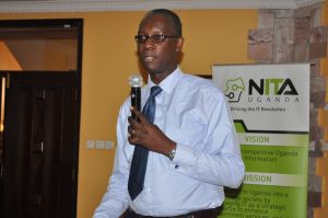 Wilbrod Humphreys Owor, Executive Director, Uganda Banker’s Association, gives remarks during the meeting with NITA-U.