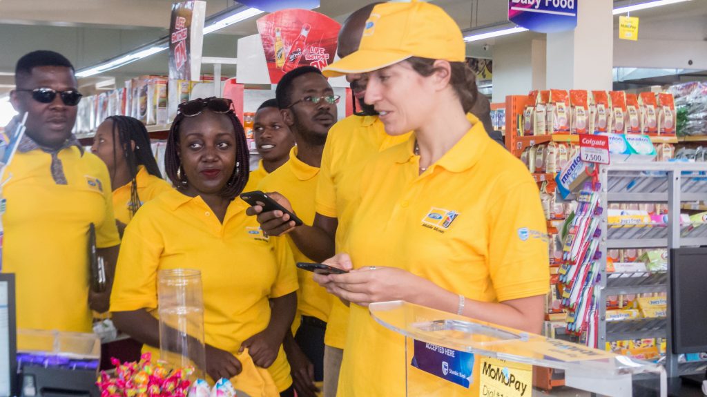 MTN Uganda's General Manager for Mobile Financial Services, Elsa Muzzolini paying for her products using MTN MomoPay at the Ntinda Shopping Centre in Ntinda after the re-launch of the service on Thursday 16th, August 2018.