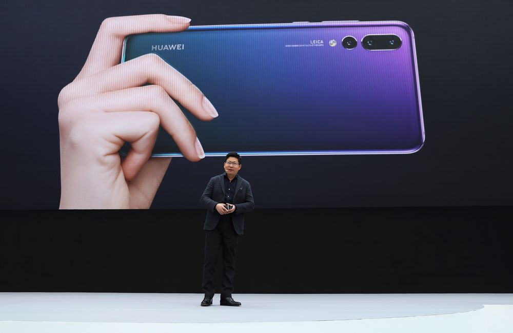 Richard Yu keynotes during the unveiling of the Huawei P20 and P20 Pro smartphones in Paris on March 21, 2018 (Photographer: Marlene Awaad/Bloomberg).
