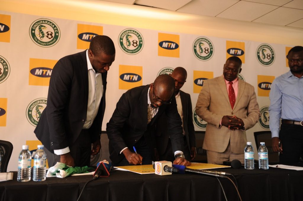 Martin Sebuliba, MTN Uganda Senior Manager Brand and Communications signs the cheque to symbolize the sponsorship. This was during a press brief held at the MTN Uganda offices in Nyonyi Gardens in Kampala on Thursday 31st, January 2019.