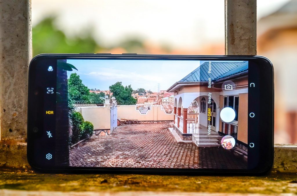 Pictured using the Tecno Camon 11 Pro to take a photo using its dual rear camera.