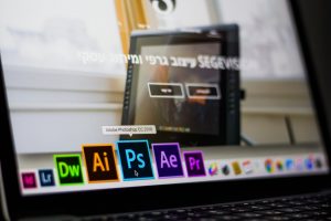 A laptop pictured showing an Adobe suit collection Photoshop, Lightroom, Premiere Pro, Dreamweaver, Affect Effects, Illustrator, and InDesign | Photo by Matan Segev from Pexels