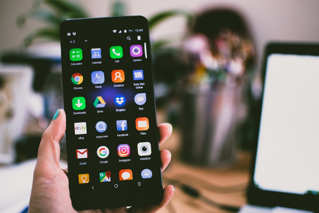 A person pictured display various types of apps on their Android smartphone | Photo by Lisa Fotios from Pexels.