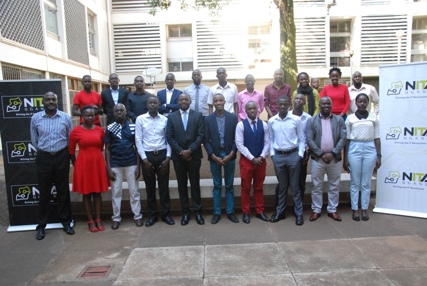 Journalists from Print, Radio, Television and Online media houses pose for a group photo with the NITA-U team at the Information Access Center in Kampala on Tuesday 26th, February 2018 during their training program on Cyber security.
