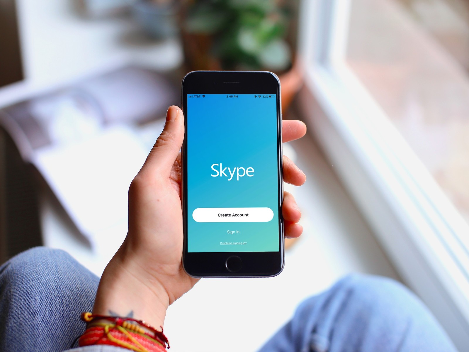 A person pictured opening the skype application on their iPhone smartphone | Courtesy Photo/File Photo