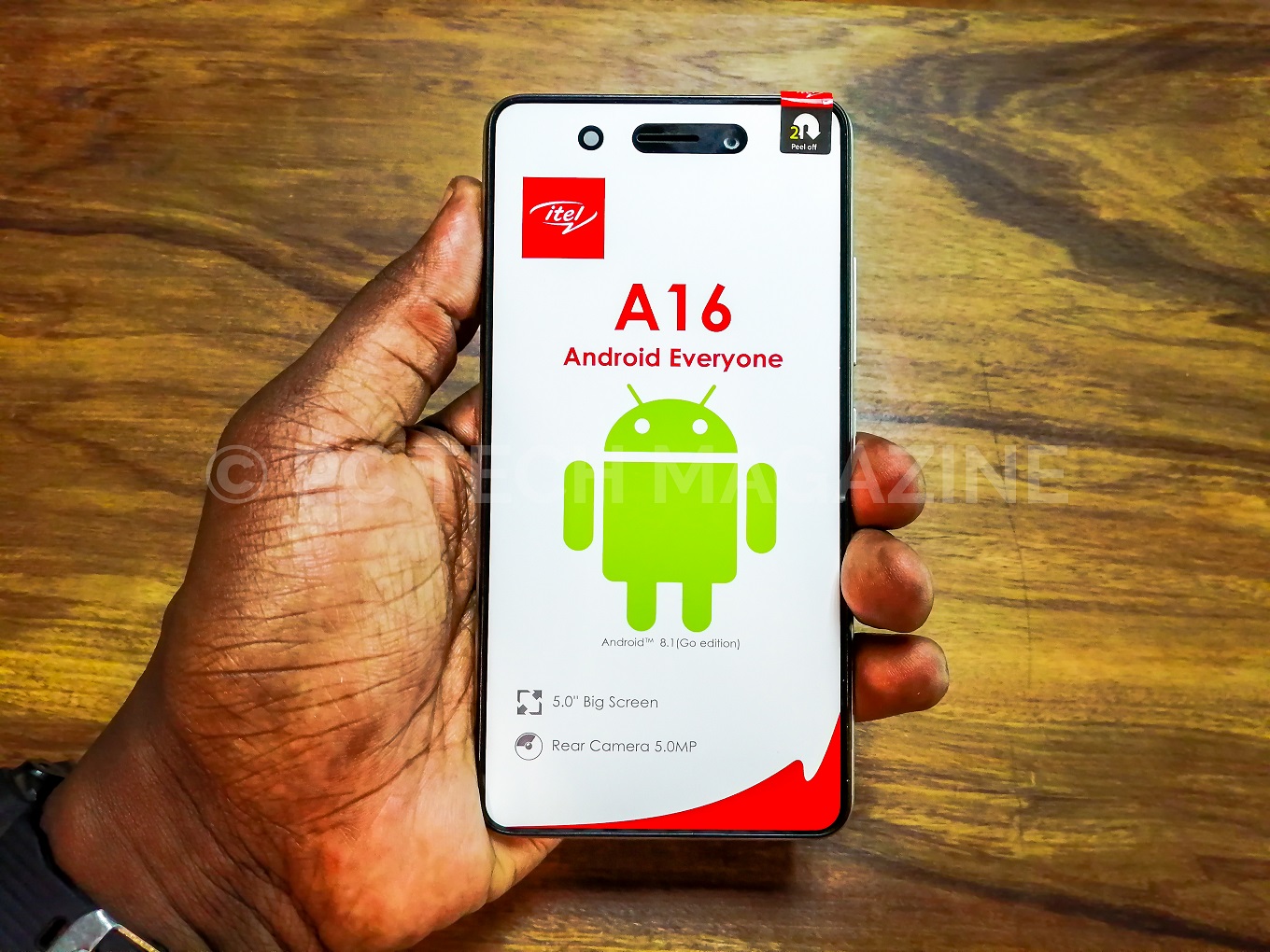 A consumer displays the itel A16 the newest entry level smartphone in the itel A-series | Photo by : PC TECH MAGAZINE/Olupot Nathan Ernest.