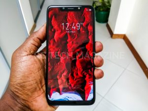 A user displays off - holding the Infinix HOT 7 smartphone | Photo by PC Tech Magazine/Olupot Nathan Ernest.