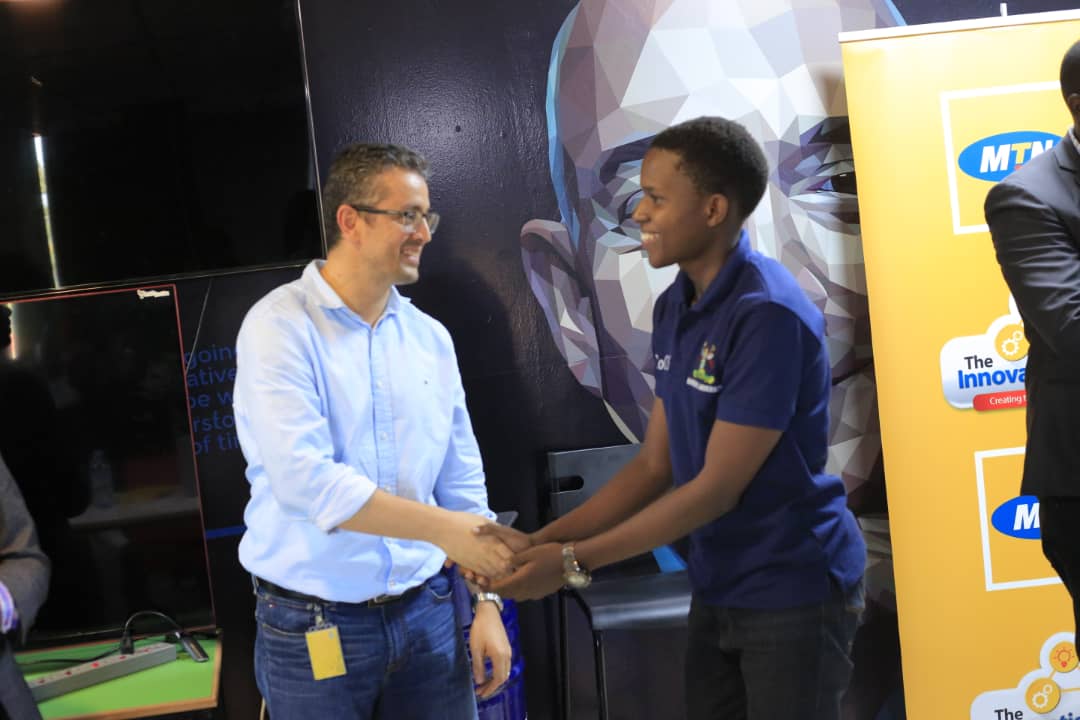 Monzer Ali; MTN Uganda acting General Manager of Mobile Financial Services greets one of the winners of the MTN API App Challenge at The Innovation Village on Friday March, 22nd 2019.