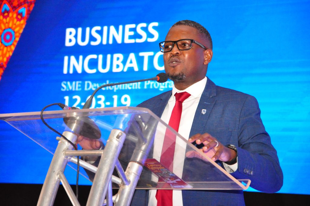 Mr Tony Otoa O the Stanbic Head of Business Development makes a presentation during the Enterprise Conference at Hotel Africana in Kampala, Uganda on Tuesday 12th, March 2019.