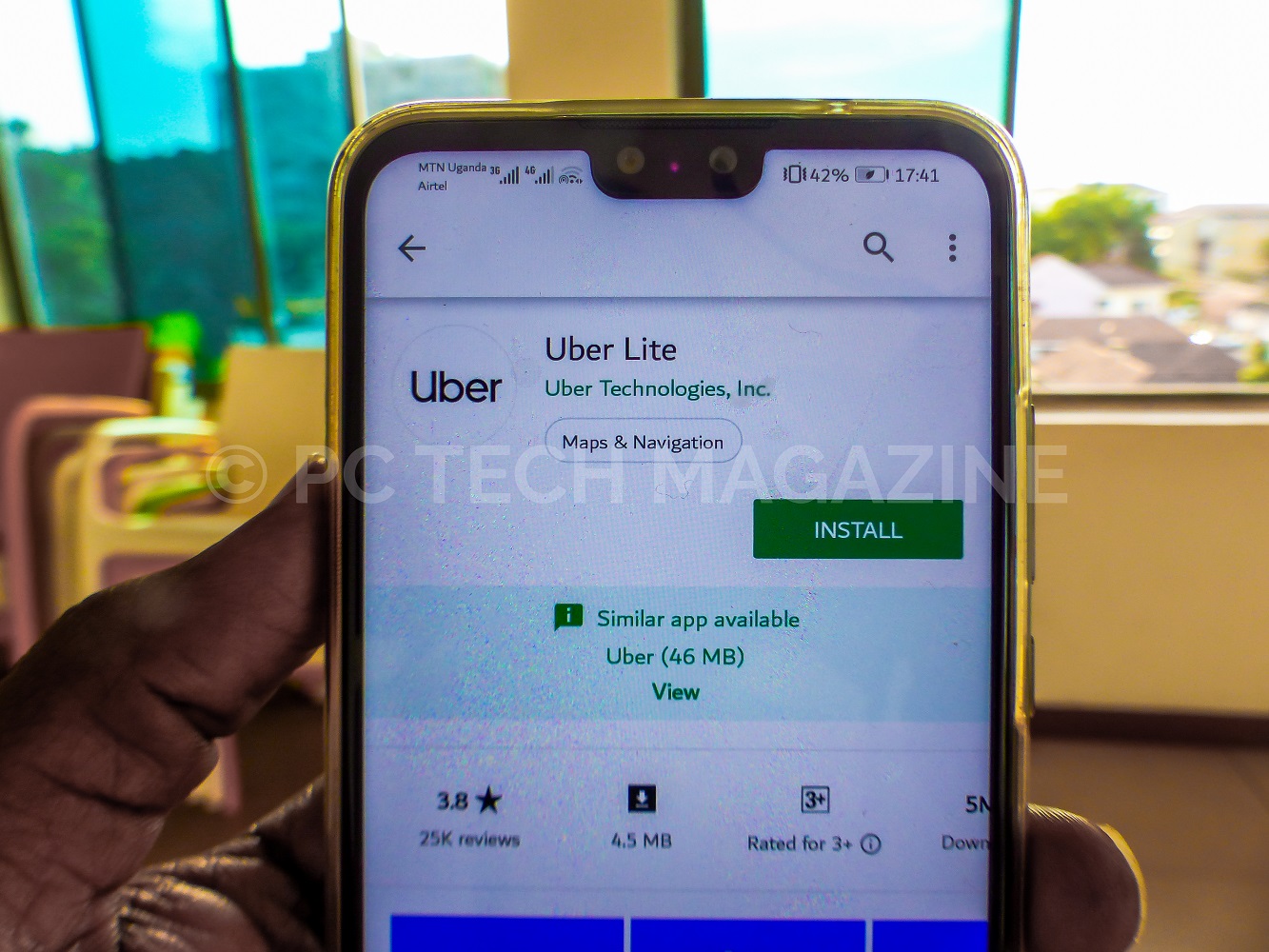 A user displays a uber lite app installation in google play store | Photo by PC TECH MAGAZINE/Olupot Nathan Ernest.