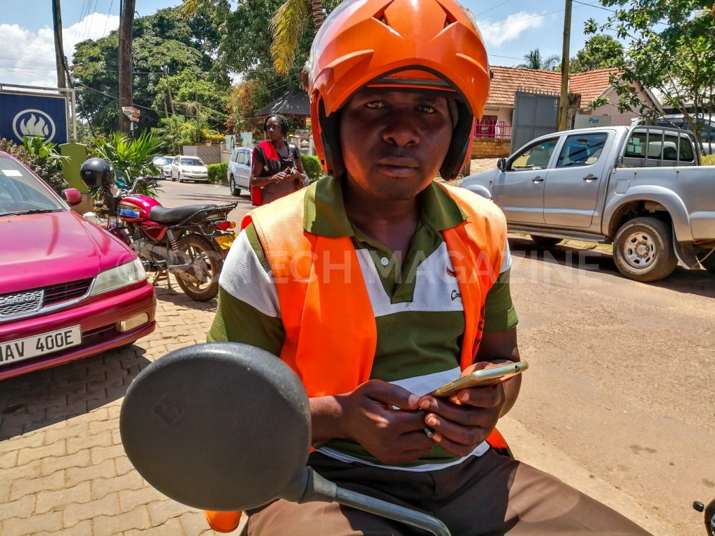Safeboda rider, Wandera (SB 8253) is one of the riders that are permitted to selling credit to customers | Photo by PC TECH MAGAZINE/Olupot Nathan Ernest.