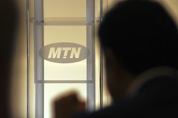 MTN logo seen in a shilloute shot | Photo By: Waldo Swiegers/Bloomberg.