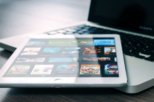 Pictured is a Tablet Computers resting on a MAC laptop. Courtesy Photo.