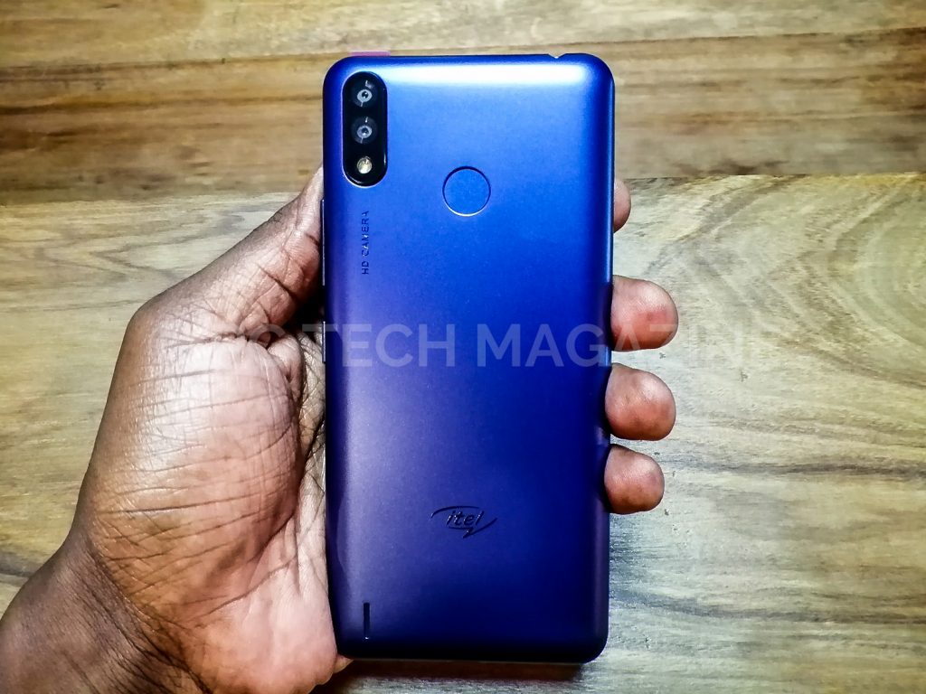 The build of the itel P33 shows the fingerprint at the back, a vertical dual rear camera and a single speaker at the side left | Photo by PC TECH MAGAZINE/Olupot Nathan Ernest.
