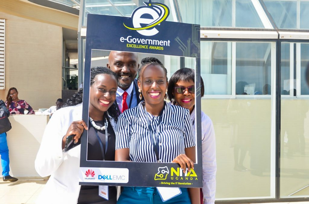 Some of NITA Uganda officials pose for a group photo with the cut-out board of the e-Government Execllence Awards after the launch at the Skyz Hotel in Kampala on Tuesday 28th, May 2019.