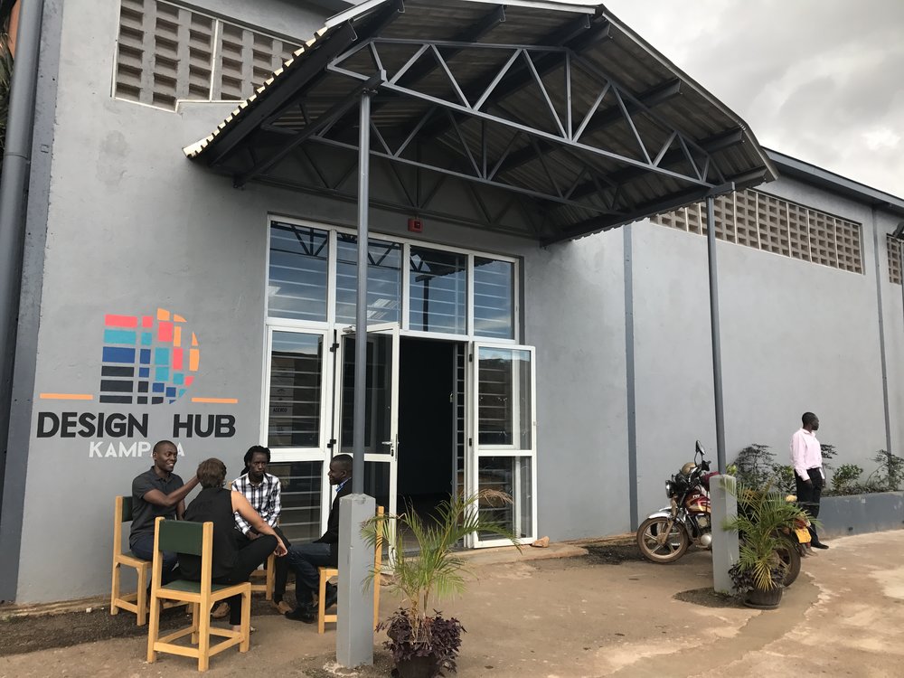 A group of people seen seated outside Design Hub Kampala. File Photo