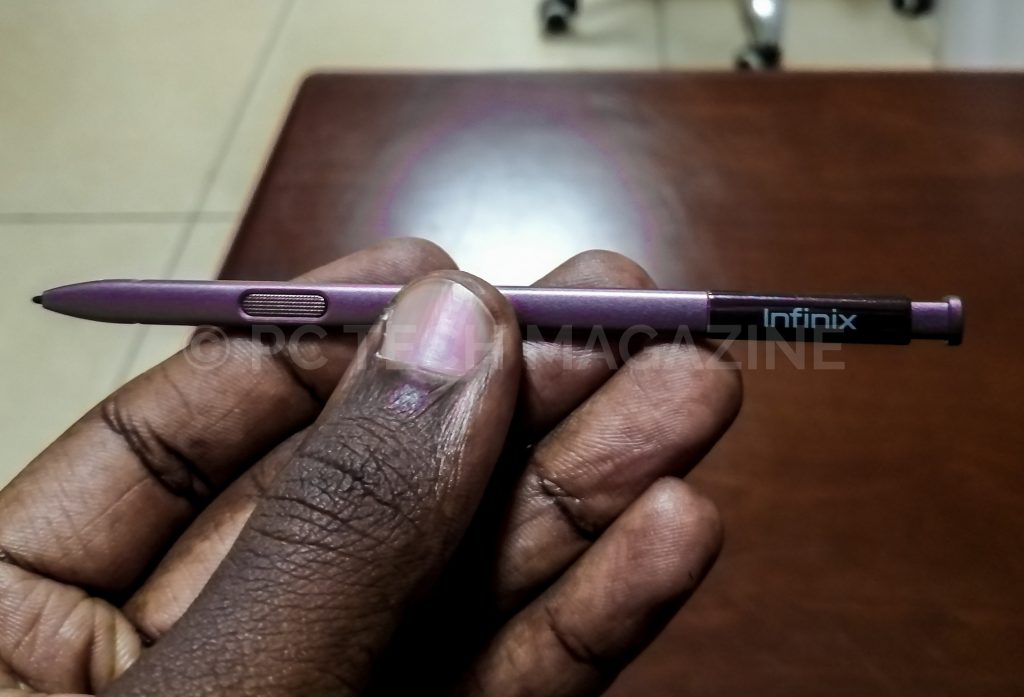 Holding the X Pen for the Infinix Note 6.