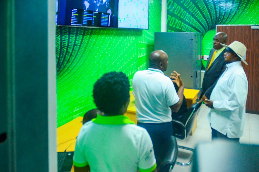 President Museveni being toured inside the National Tier 3 Data Center in Jinja by NITA Uganda's Peter Kahiigi.