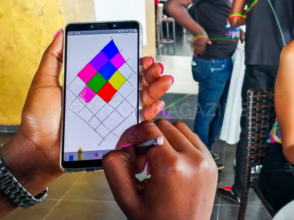 A user seen painting using the Infinix Note 6. Photo by: PC TECH MAGAZINE/Olupot Nathan Ernest