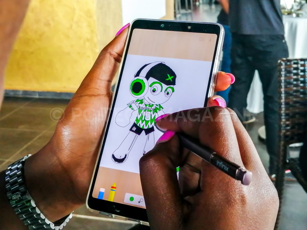 A user seen making a drawing on the Infinix Note 6. Photo by: PC TECH MAGAZINE/Olupot Nathan Ernest