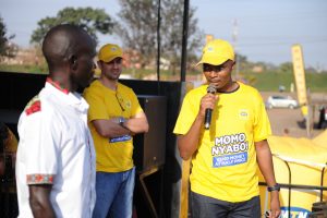 MTN Uganda's Senior Manager MFS products; Christopher Ssali speaking at the grand finale of the second edition of MTN Momo Nyabo campaign at katwe market on Saturday 24th, August 2019.