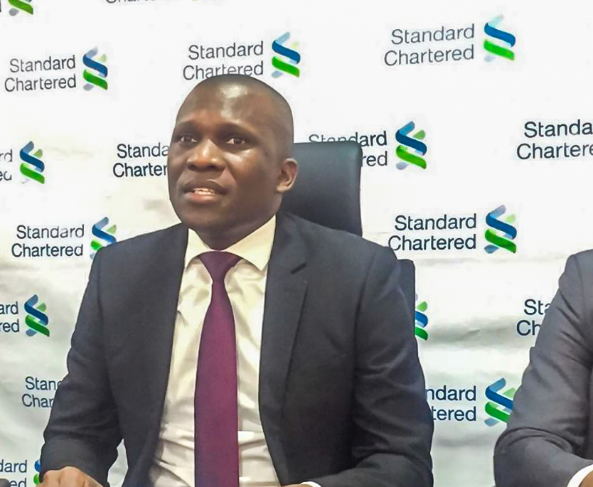 Moses Rutahigwa; Standard Chartered Bank Head of Retail Banking briefing the press about their newly launched SC Keyboard.
