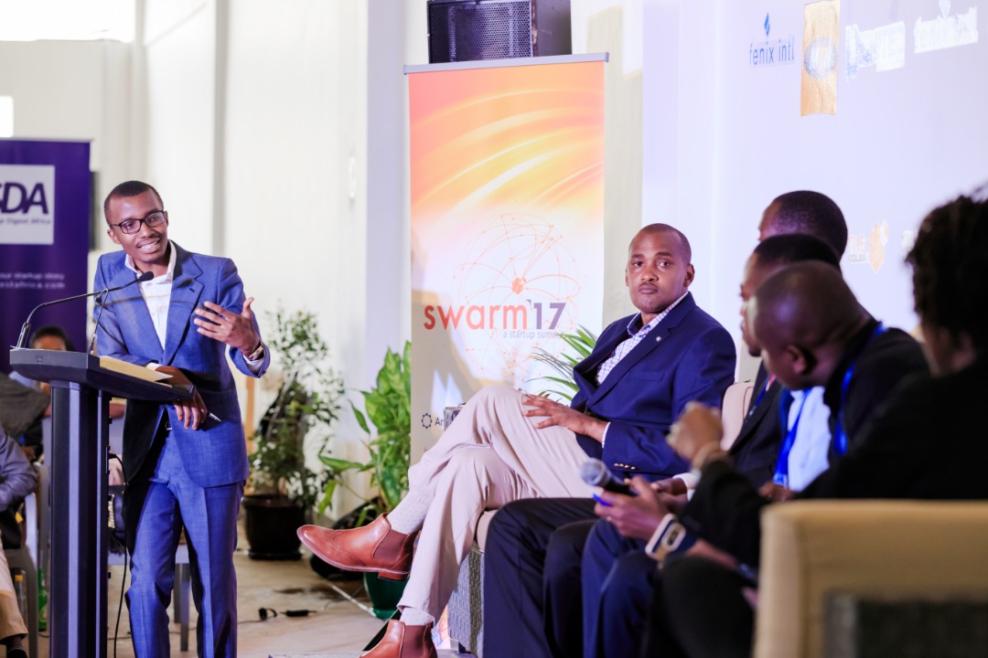 NBS Journalist; Raymond Mujuni moderating a panel discussion at the 2017 swarm summit. File Photo/Hive Colab