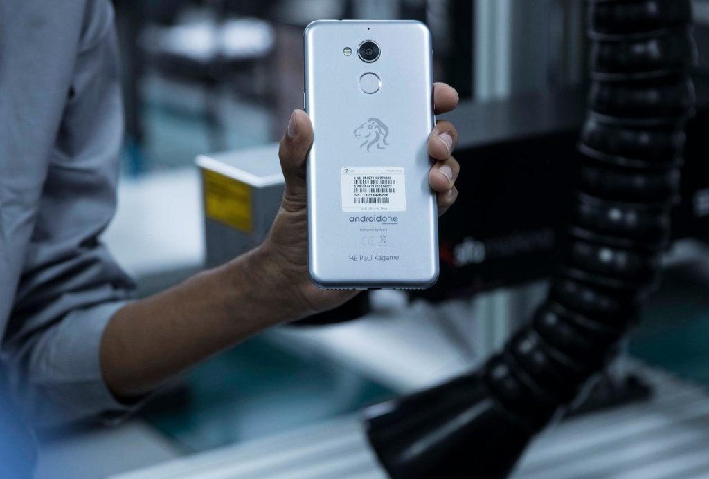 One of the workers displays the Mara Z smartphone, Made in Rwanda. Courtesy Photo / Rwanda Broadcasting Agency
