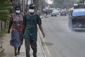 COVID-19: People walk along a main road wearing face masks at Yaba in Lagos, on February 28, 2020. Pius Utomi Ekpei/AFP via Getty Images