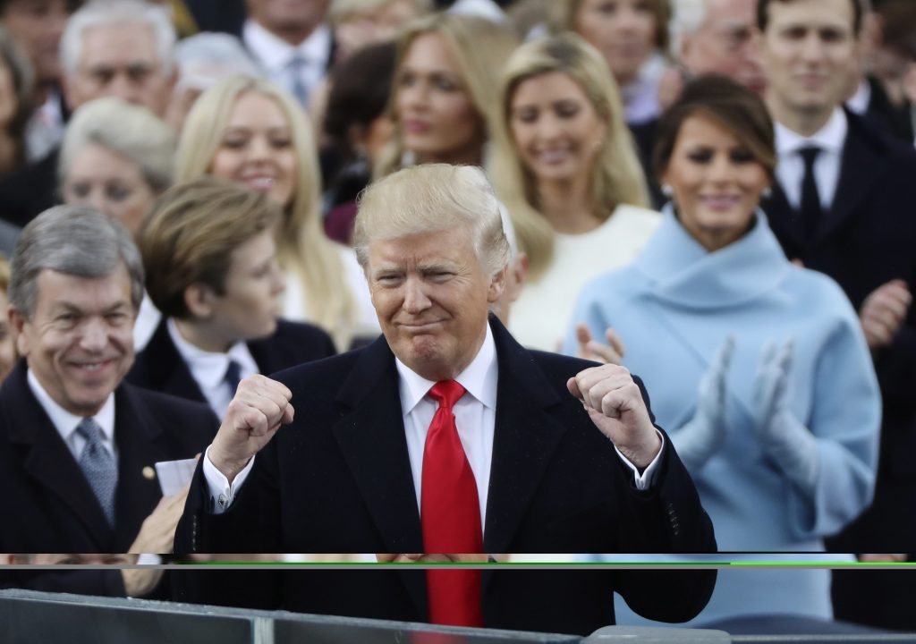 President Donald Trump celebrates after inauguration ceremonies swearing him in as the 45th president of the United States on the West front of the U.S. Capitol in Washington, U.S., January 20, 2017. REUTERS/Carlos Barria (UNITED STATES - Tags: POLITICS) - RTSWIU1