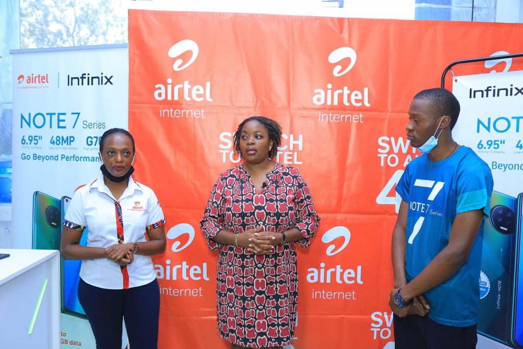 Ms. Remmie Kisakye (center); Airtel Uganda Head Brand and Communications poses for a group photo with Infinix representatives after launching the Infinix NOTE7. Courtesy Photo