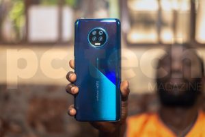 A person holding the Infinix NOTE7 showing the quad-rear camera. Photo by OLUPOT NATHAN ERNEST | PC Tech Magazine