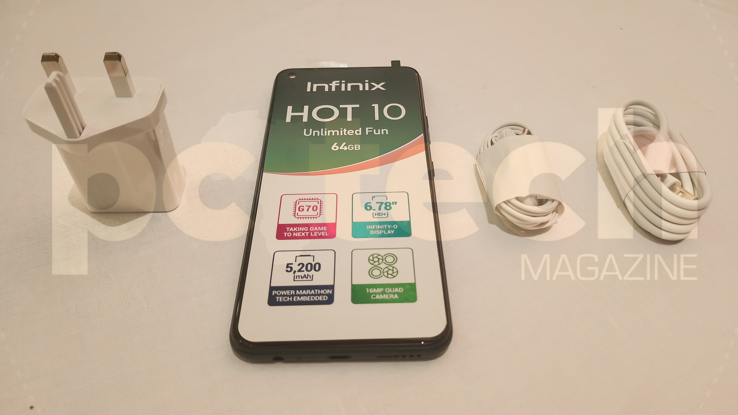 Unboxing you get the Infinix HOT 10, its accessories including; a charging brick, charging chord that does act like a transfer data cable, standard 3.5mm earphones. Photo by: Olupot Nathan Ernest | PC TECH MAGAZINE