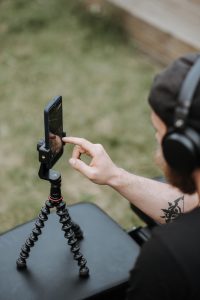 Having a smartphone on a tripod for a second camera view is an excellent way to maximize your video studio options. (PHOTOGRAPHER: Anete Lusina from Pexels)