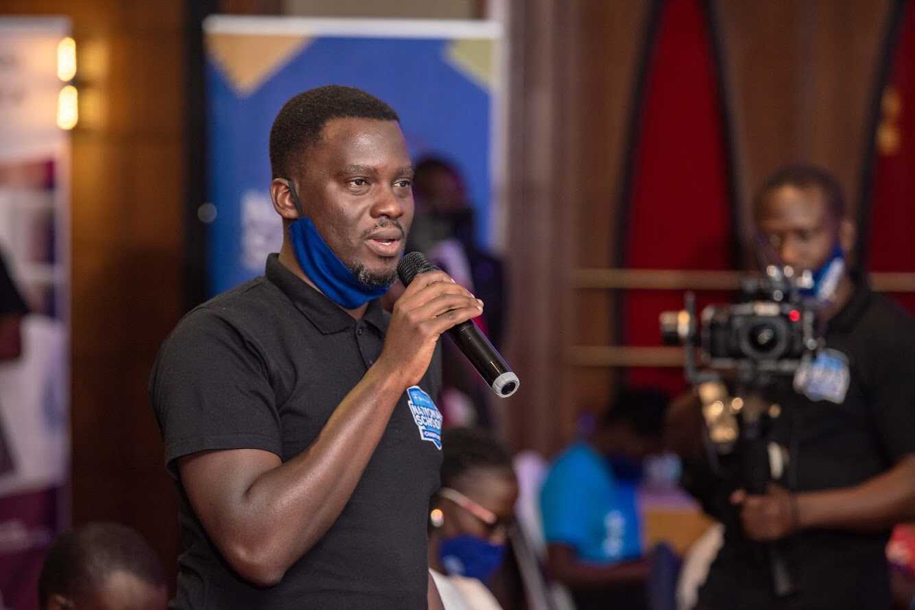 Peter Mukiibi, Creative Director at Addmaya addressing the audience at the Stanbic National School's Championship 2020 grand finale. (COURTESY PHOTO)
