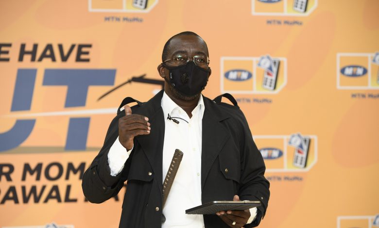 MTN Uganda General Manager of Mobile Financial Services, Mr. Stephen Mutana speaking at the launch of the new MTN mobile money withdrawal fees at Hotel Africana. (PHOTO: MTN)