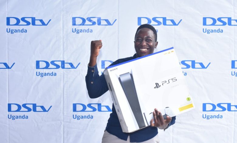 Edward Kategaya joyful after winning a brand new PlayStation 5 (PS5) from DStv Uganda after he gather the most points from DStv's last season fantasy premier league. (PHOTO: DStv Uganda)