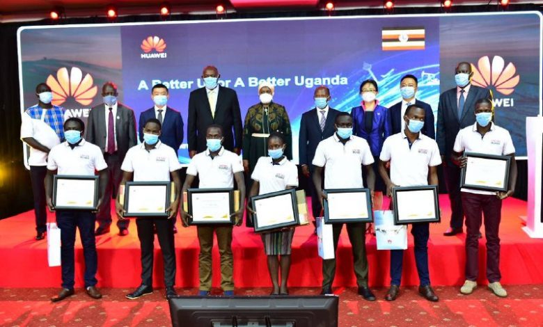 Ugandan students who won in Regional and Global Huawei ICT Competition in 2020 pose for a group photo with Deputy Prime Minister, ICT Minister, State Minister for Higher Education and Huawei Representatives.
