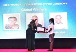 Rt. Hon. Rukia Nakaddama Isanga (left) awarding Doreen Nalwoga for her execllent performance in the Huawei ICT Global Competition.