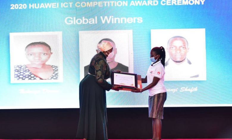 Rt. Hon. Rukia Nakaddama Isanga (left) awarding Doreen Nalwoga for her execllent performance in the Huawei ICT Global Competition.