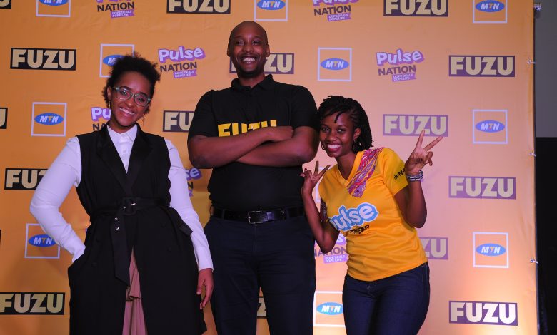 In Pictorial (L-R) MTN Pulse Ambassador; Faiza Fabs, FUZU Uganda Country Manager; Alvin Katto, and MTN Youth Segment Manager; Hellen Kirungi pose of a group after announcing partnership at the FUZU Uganda head offices.