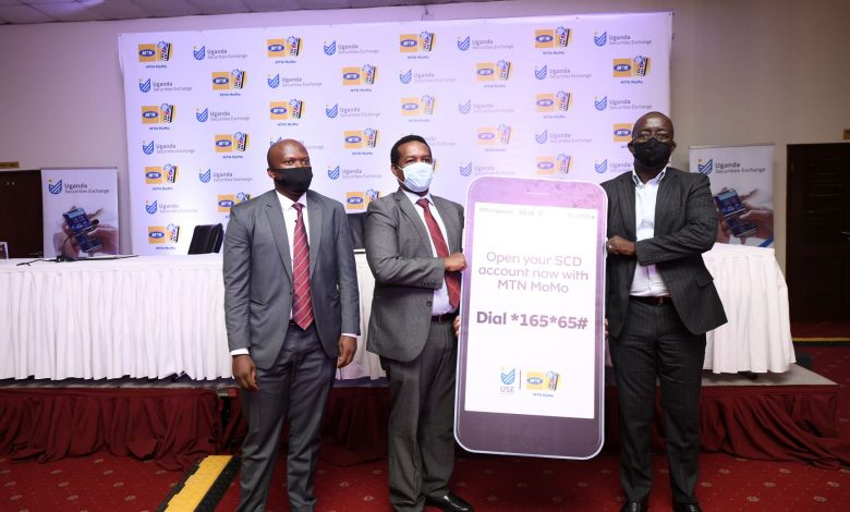 In Pictorial (L-R): Bob Musinguzi; Manager SCD-USE, Paul Bwiso; CEO Uganda Securities Exchange and Stephen Mutan; CEO MTN Mobile Money Limited pose for a photo launching a digital SCD account opening platform.