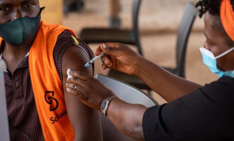 A SafeBoda employee pictured receiving a Covid-19 vaccination during the launch of the vaccine drive at the SafeBoda Academy.