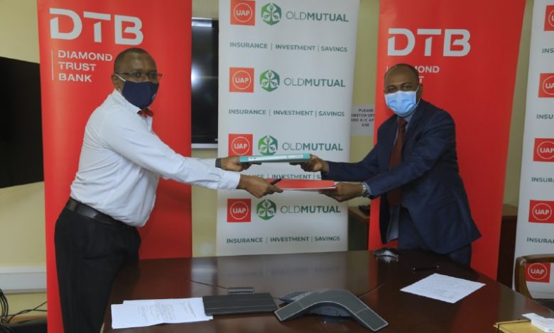 Maina Kariuki the Executive Director of DTB and Harrison Gongo the Managing Director UAP Old Mutual Life Assurance Uganda limited officiate their partnership.
